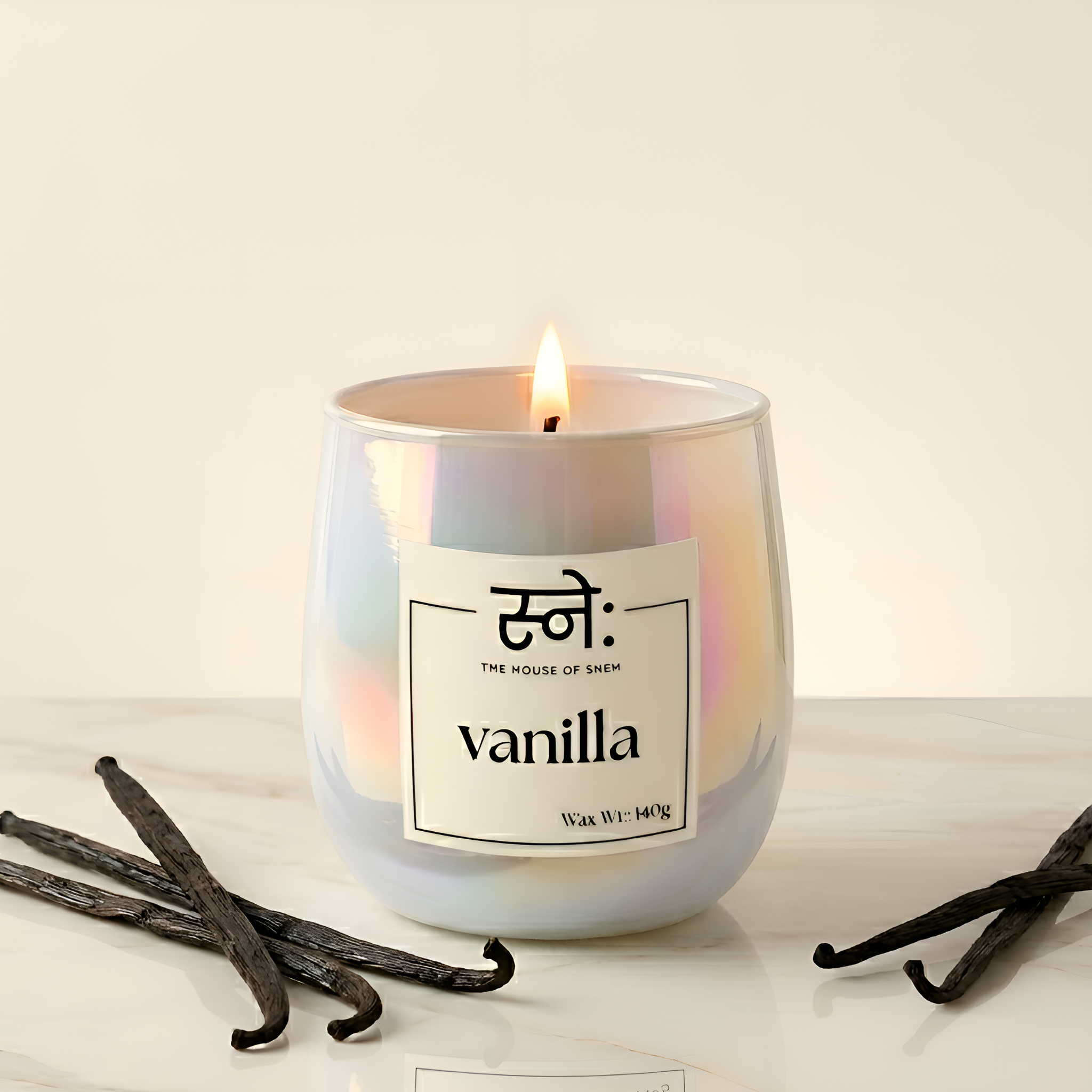 Vanilla scented candle styled in warm studio setting with neutral props, The House of Sneh