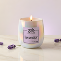Lavender scented candle styled in warm studio light with botanical props, The House of Sneh