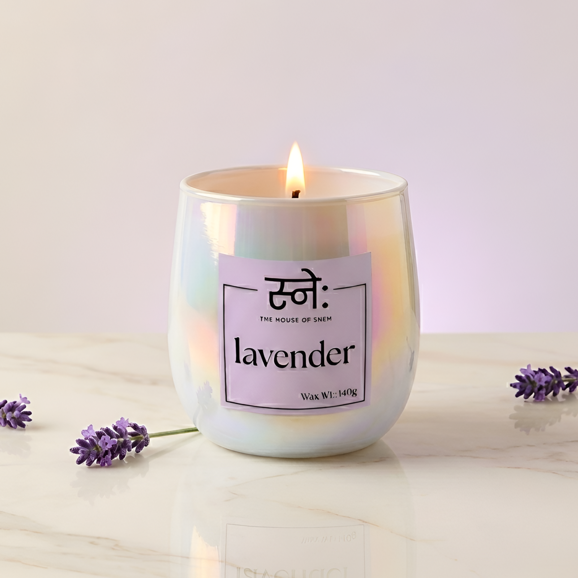 Lavender scented candle styled in warm studio light with botanical props, The House of Sneh