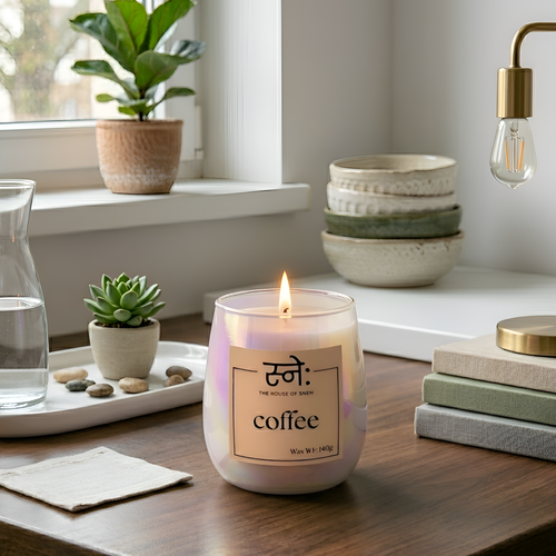 Coffee candle on wooden tray with roasted coffee beans in warm morning setting