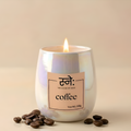 Coffee scented candle styled in moody studio light with coffee props, The House of Sneh