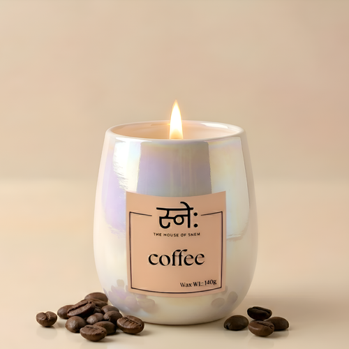 Coffee scented candle styled in moody studio light with coffee props, The House of Sneh